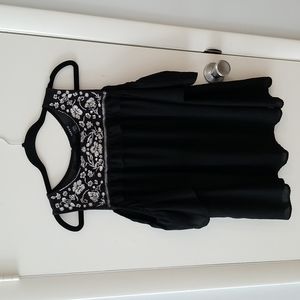 Torrid cold shoulder top with embroidery top portion black with white stitches